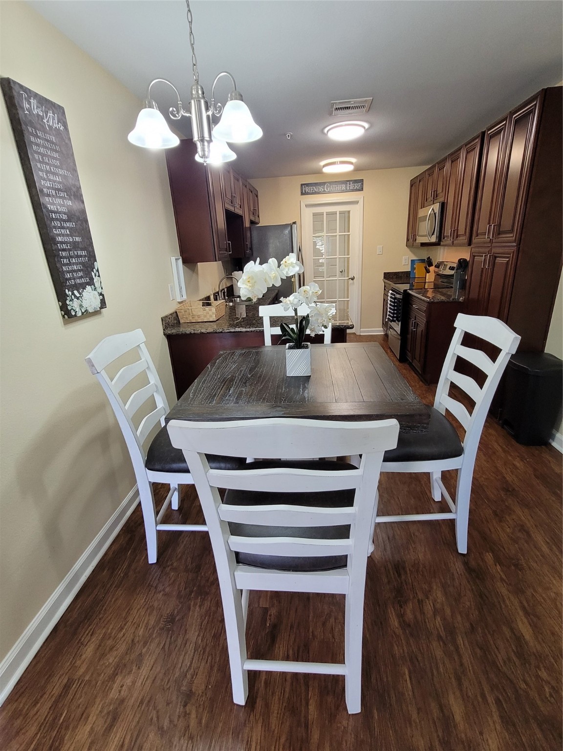4426 25th Street East, Unit C Dickinson, TX 77539 - Photo 22 of 31 a view of kitchen with sink dining table and chairs