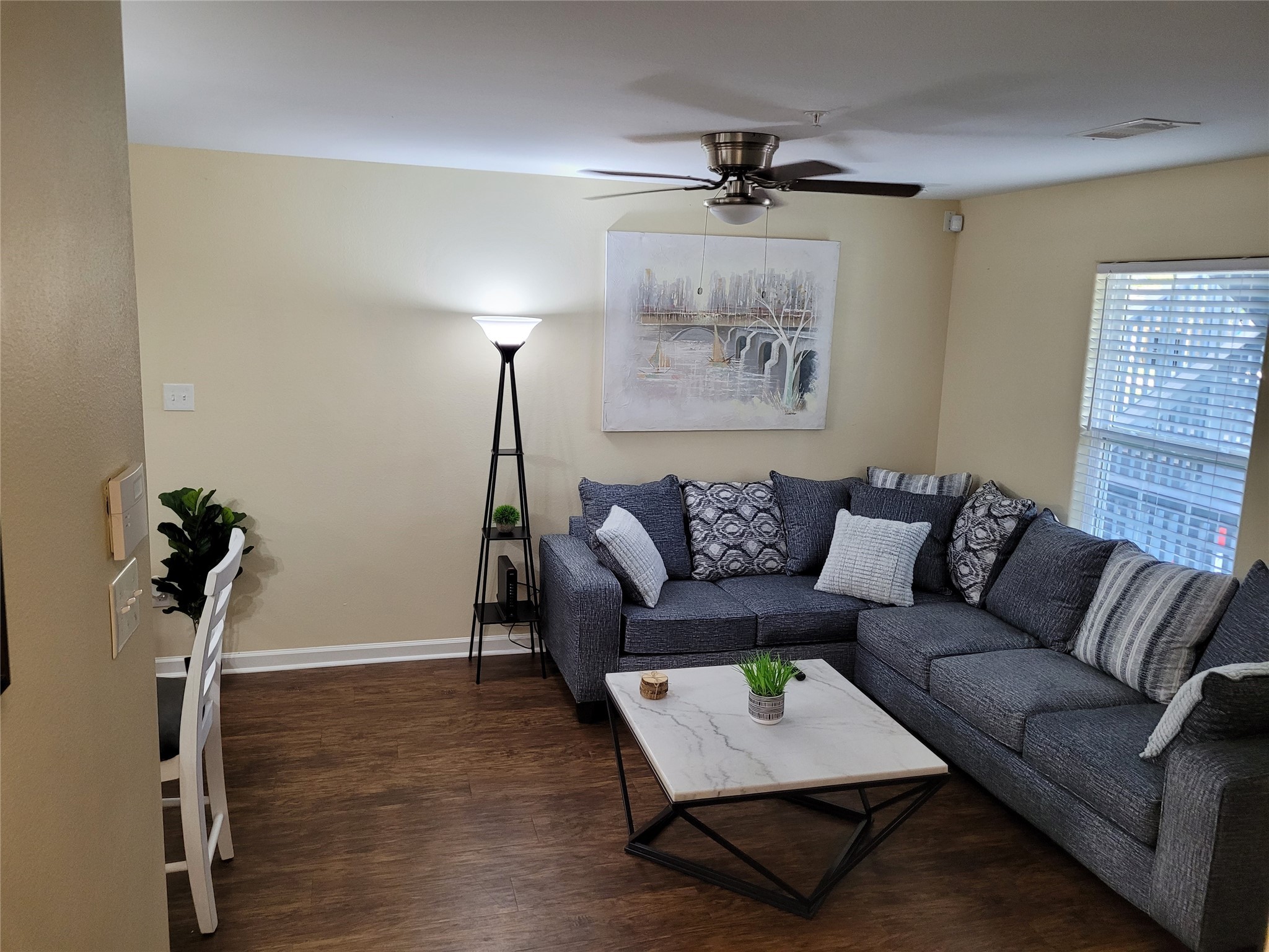 4426 25th Street East, Unit C Dickinson, TX 77539 - Photo 27 of 31 a living room with furniture and a wooden floor