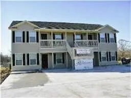 a front view of a house with brick walls