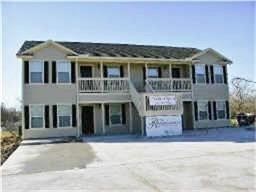 4426 25th Street East, Unit C Dickinson, TX 77539 - Photo 3 of 31 a front view of a house with brick walls