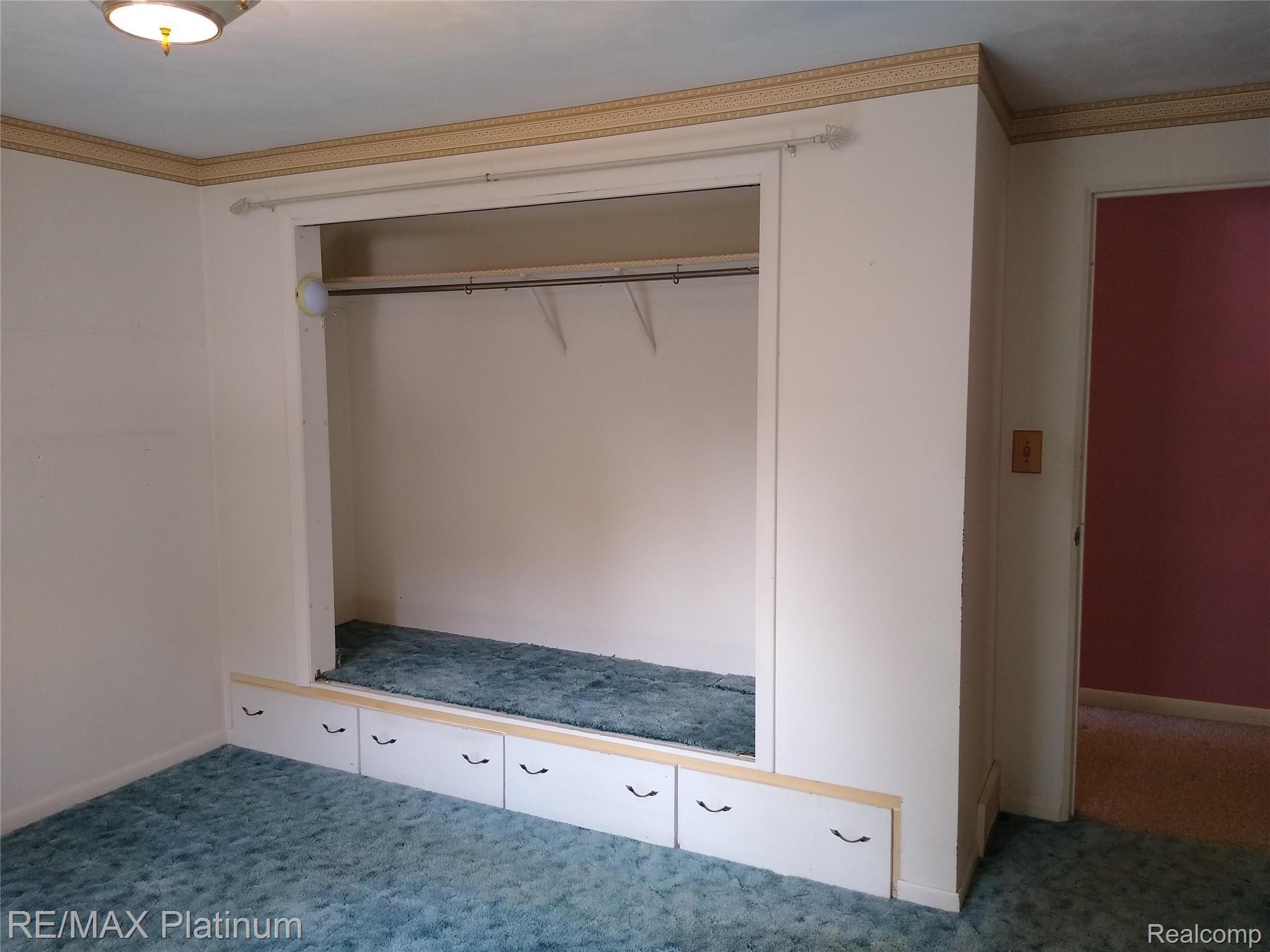 1555 Chilson Road Howell, MI 48843 - Photo 22 of 47 Bedroom closet with built-ins