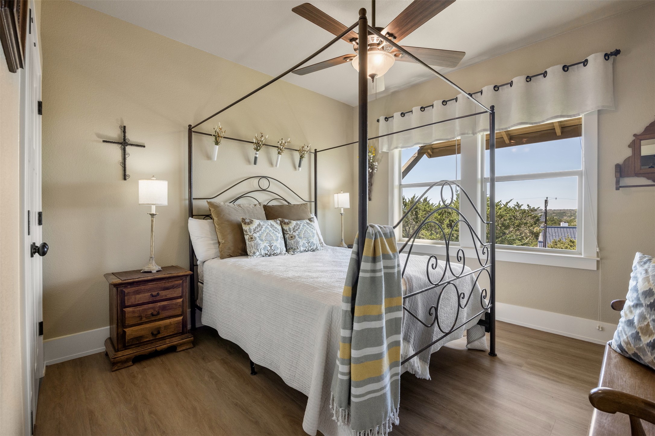 261 Barber Drive Wimberley, TX 78676 - Photo 13 of 37 Bedroom with wood finished floors and a ceiling fan