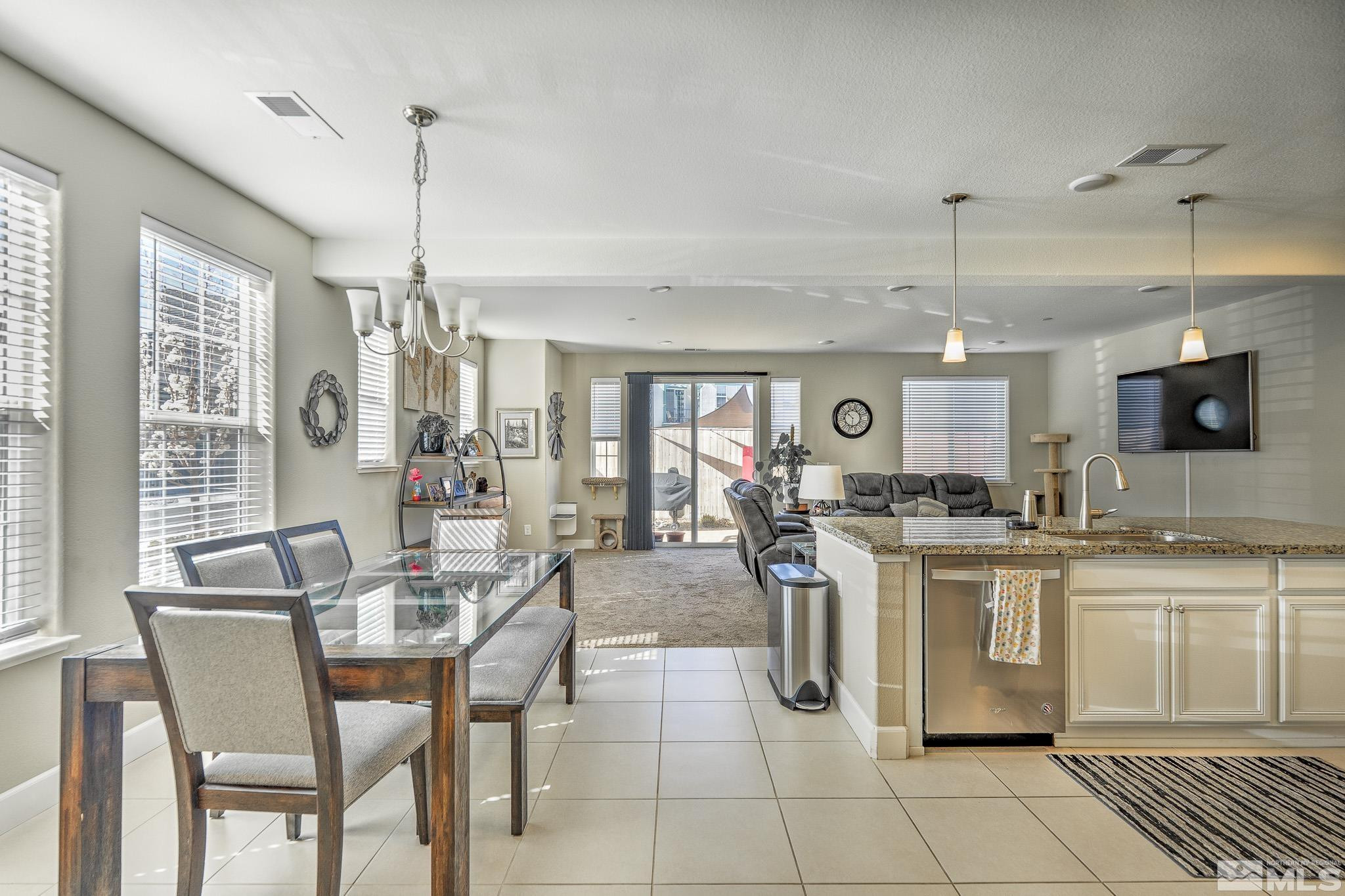 1805 Dark Horse Road, Unit C Reno, NV 89521 - Photo 6 of 35 a kitchen with stainless steel appliances granite countertop a sink and a refrigerator