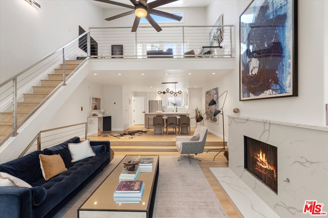 2108 Neilson Way Santa Monica, CA 90405 - Photo 1 of 70 a living room with furniture and a fireplace