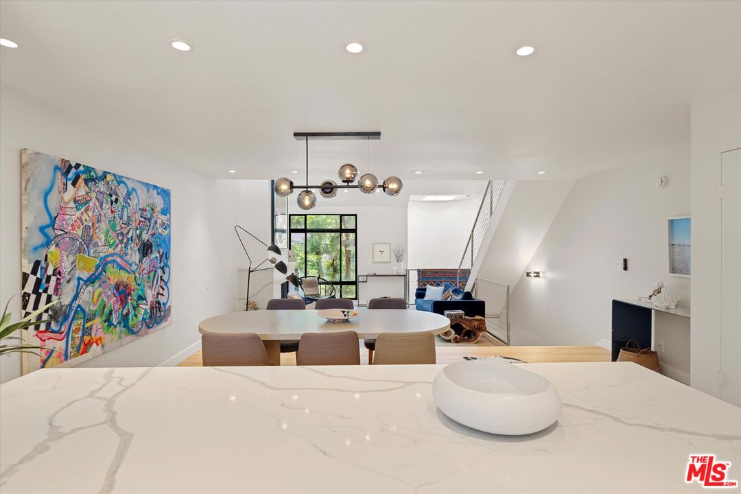 2108 Neilson Way Santa Monica, CA 90405 - Photo 14 of 70 a living room with furniture and painting on the wall
