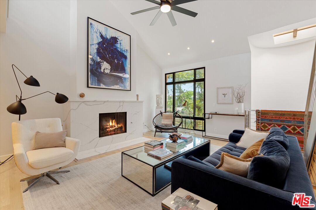 2108 Neilson Way Santa Monica, CA 90405 - Photo 16 of 70 a living room with furniture and a fireplace