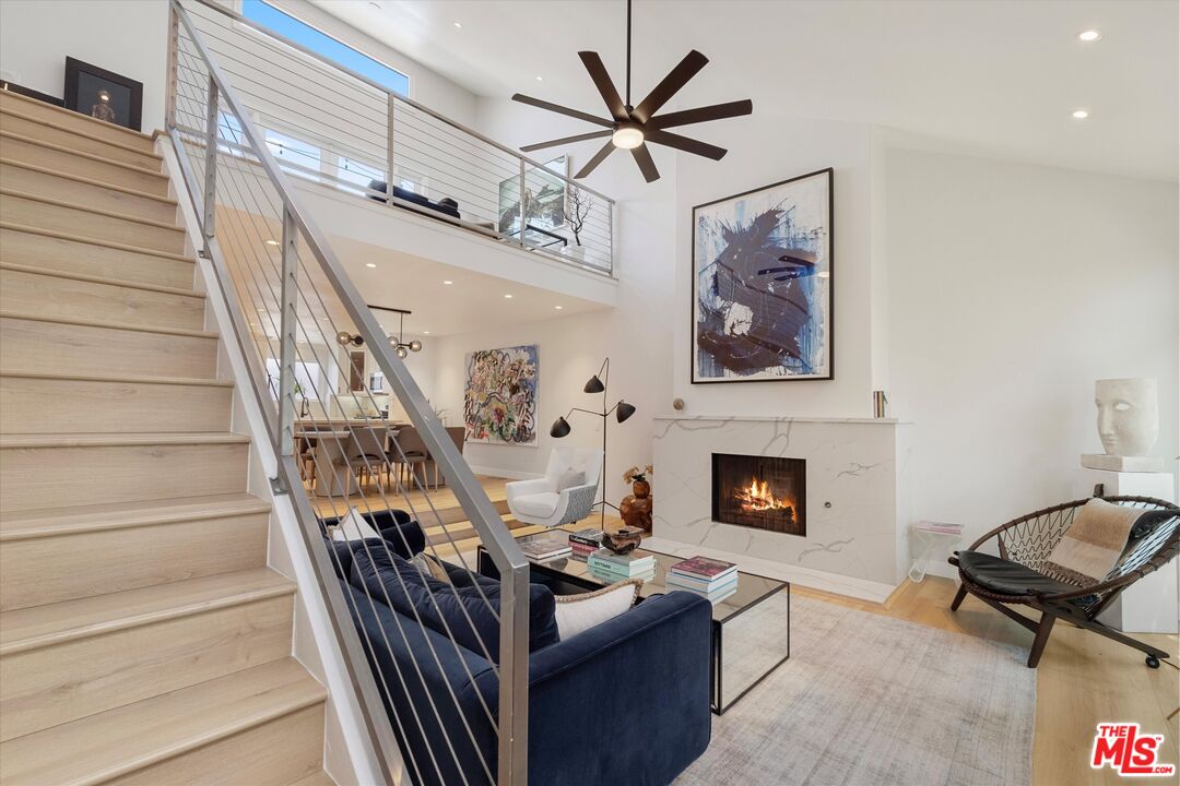 2108 Neilson Way Santa Monica, CA 90405 - Photo 22 of 70 a living room with furniture and a fireplace