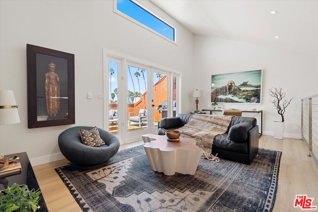 2108 Neilson Way Santa Monica, CA 90405 - Photo 23 of 70 a living room with furniture and a rug