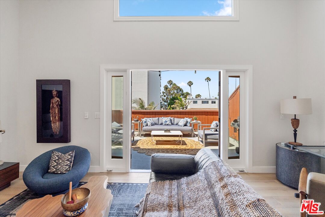 2108 Neilson Way Santa Monica, CA 90405 - Photo 24 of 70 a living room with furniture and a window