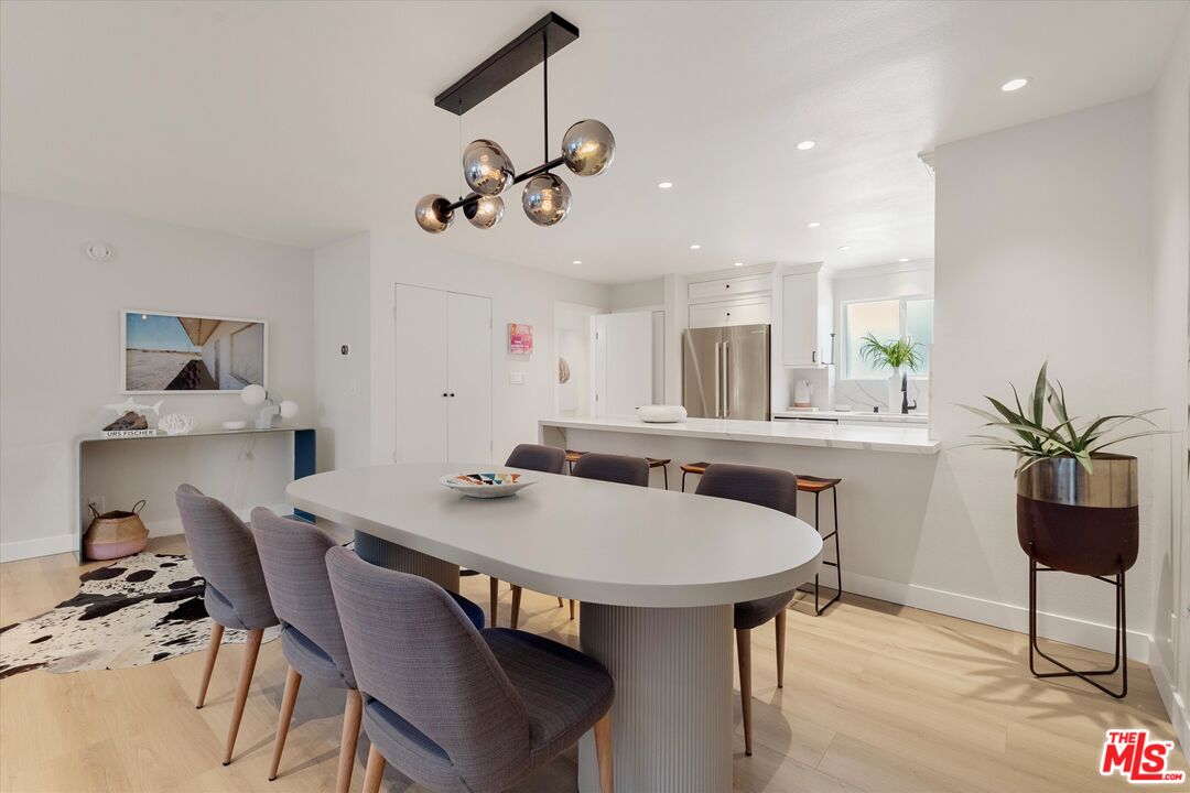 2108 Neilson Way Santa Monica, CA 90405 - Photo 6 of 70 a view of a dining room with furniture and wooden floor