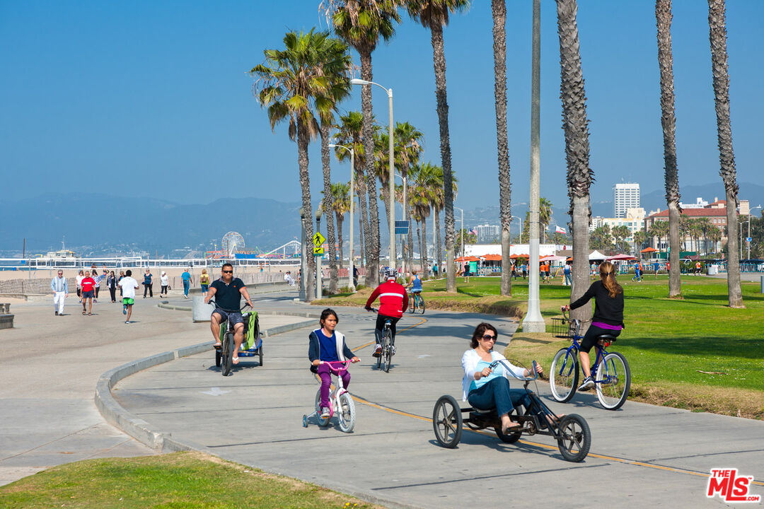 2108 Neilson Way Santa Monica, CA 90405 - Photo 62 of 70 a group of people riding bikes down a street
