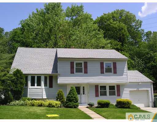 11 Amman Road Edison, NJ 08817 - Photo 1 of 10 front view of a house with a yard