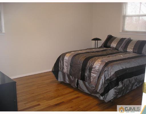 11 Amman Road Edison, NJ 08817 - Photo 6 of 10 a bedroom with a bed and a window