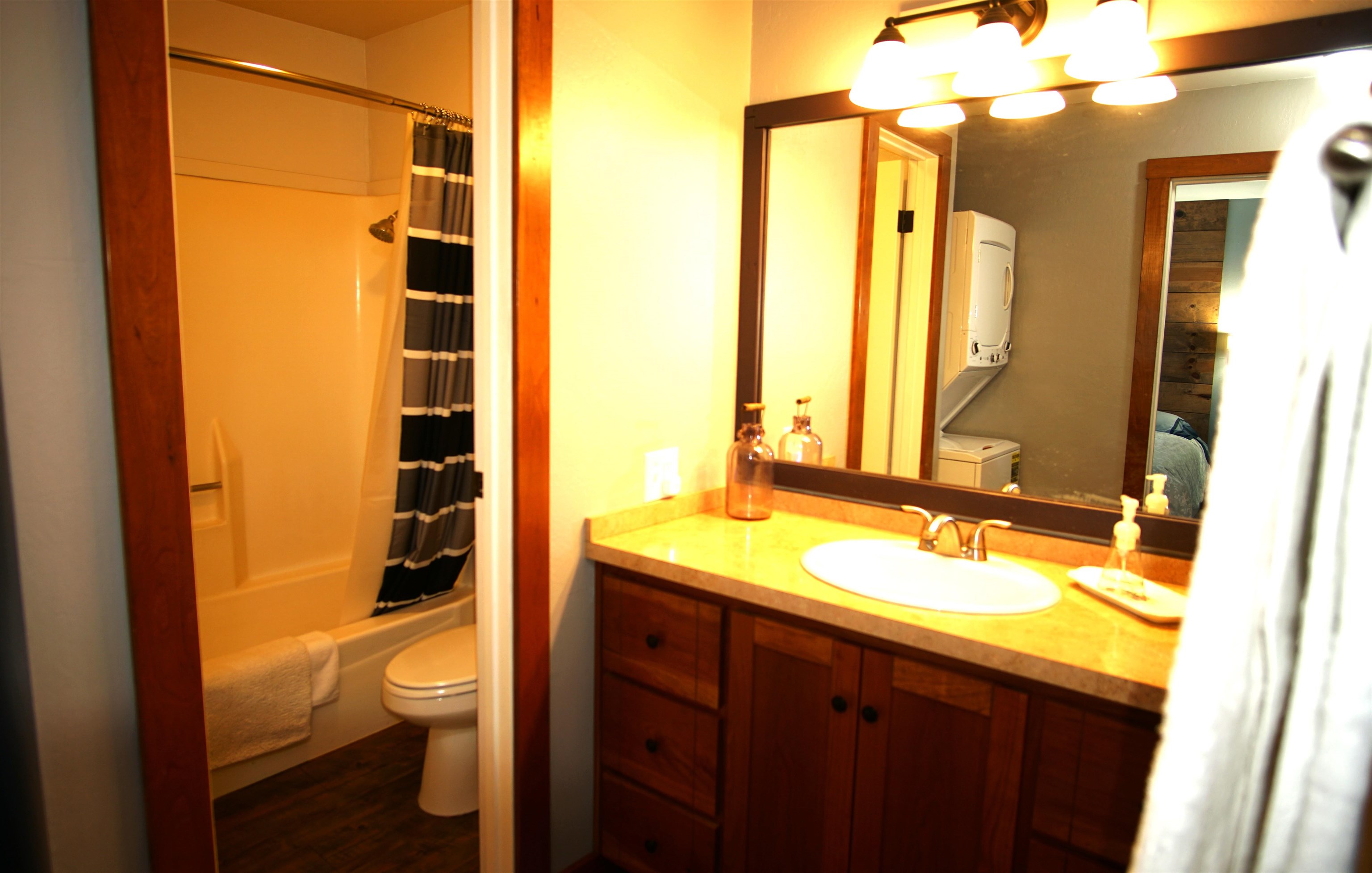 11723 Snowpeak Way, Unit 567 Truckee, CA 96161 - Photo 13 of 28 a bathroom with a sink a toilet and shower