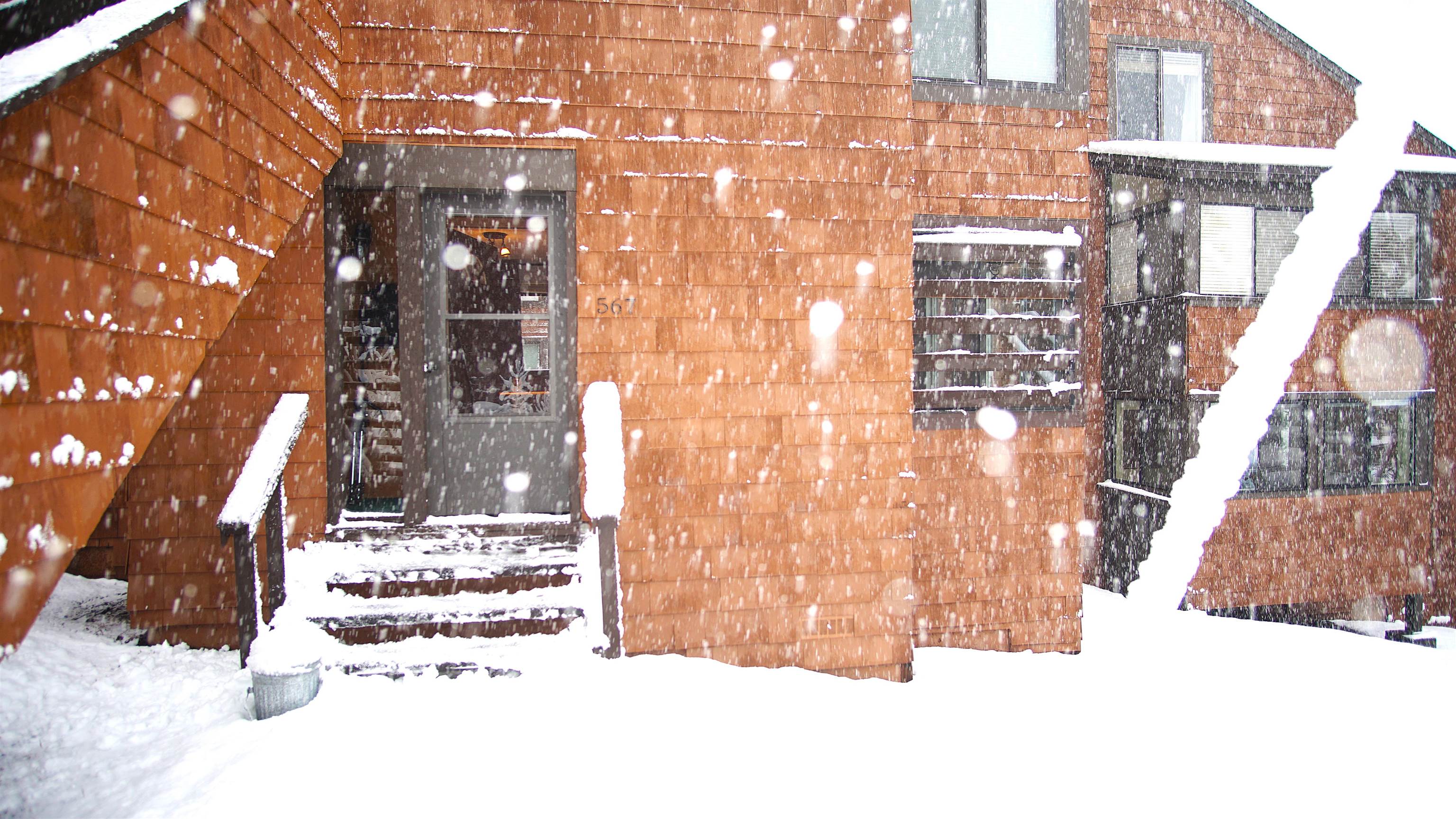 11723 Snowpeak Way, Unit 567 Truckee, CA 96161 - Photo 20 of 28 a white building with a tree in the background