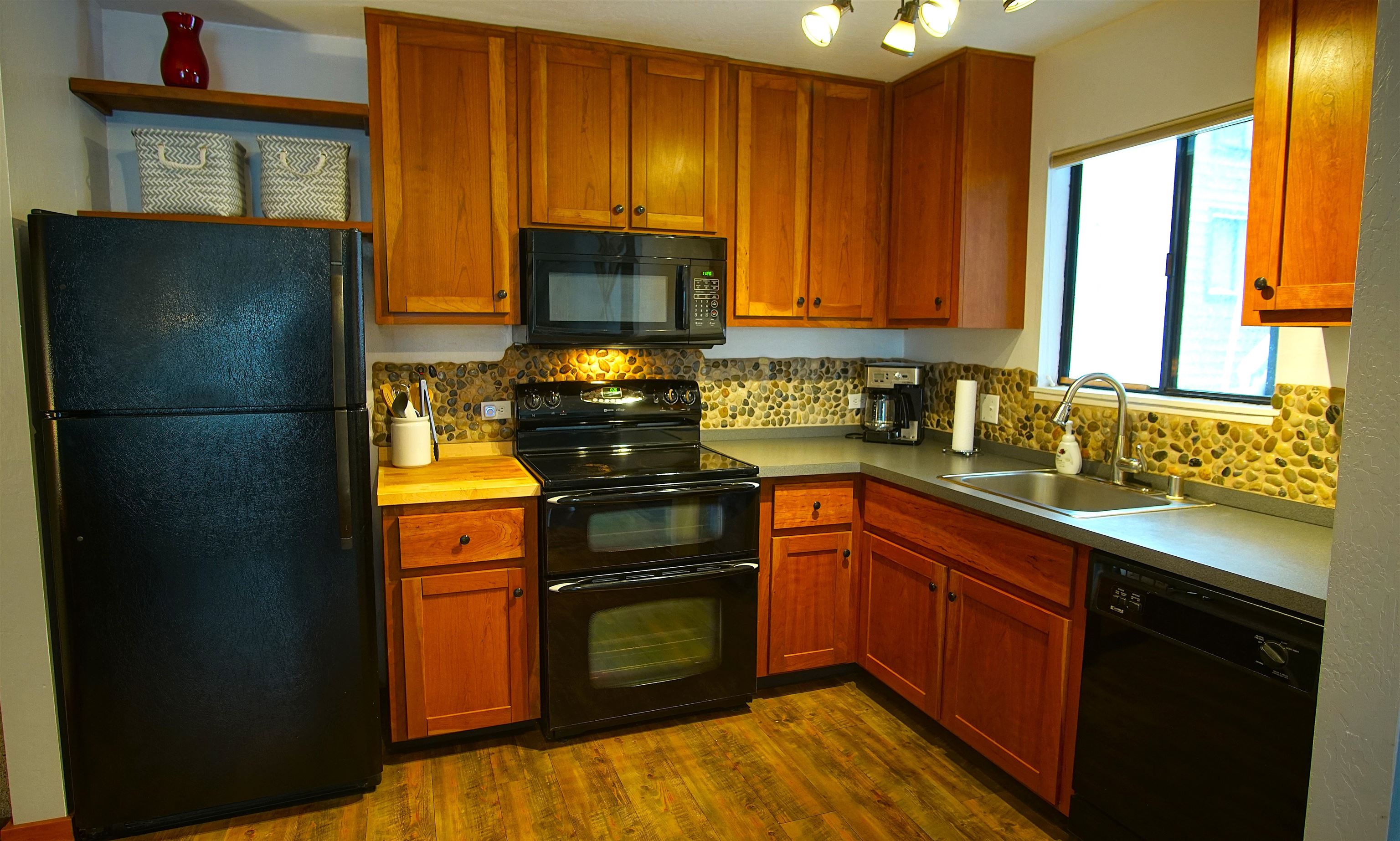 11723 Snowpeak Way, Unit 567 Truckee, CA 96161 - Photo 8 of 28 a kitchen with a refrigerator and a sink