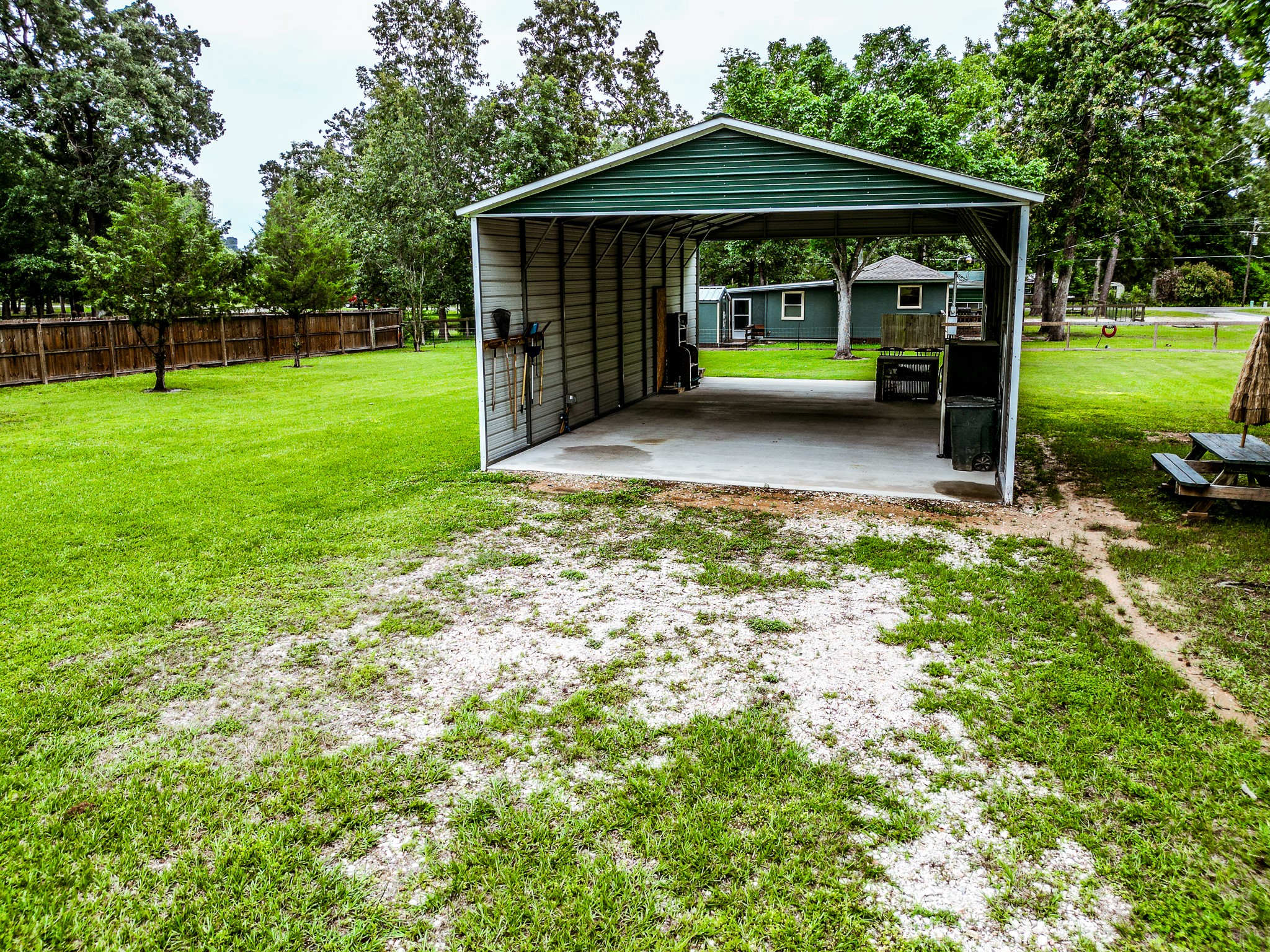 140 6th Street Trinity, TX 75862 - Photo 3 of 13 a view of a house with a backyard