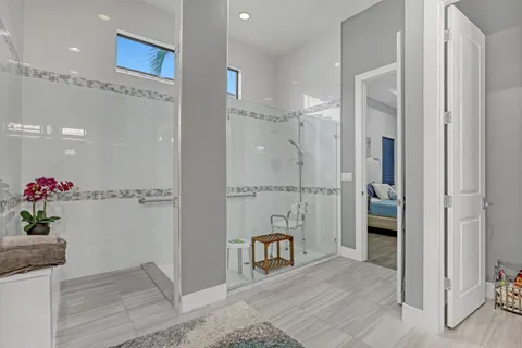 a view of walk in closet with clothes