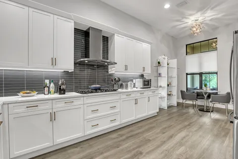 a kitchen with sink cabinets and window