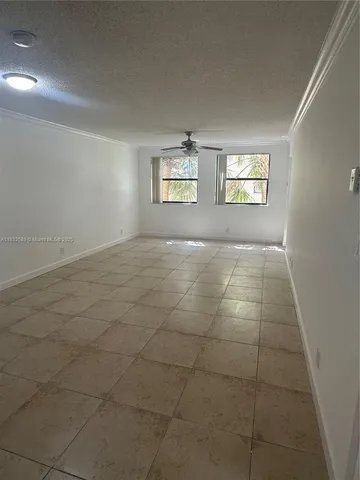 a view of an empty room and a window