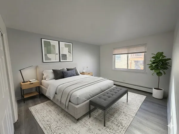 a bedroom with bed and a couch