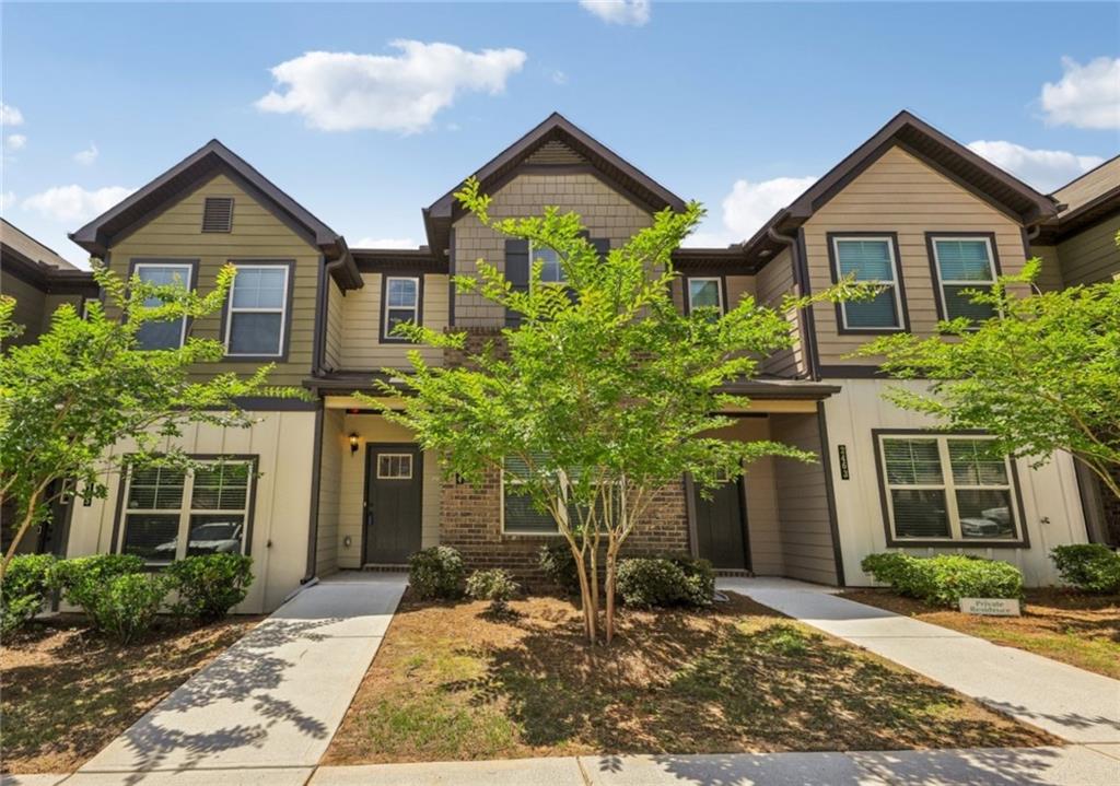 2464 Bayrose Circle, Unit 64 Atlanta, GA 30344 - Photo 1 of 1 a front view of a house with a yard