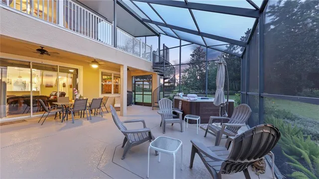 a spacious bedroom with a bed and a chandelier