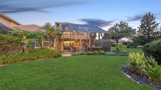 a view of a patio with a table and chairs under an umbrella
