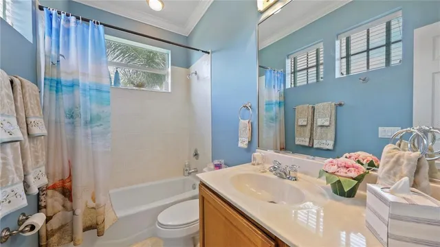 a bathroom with double vanity sinks a vanity a mirror and a shower