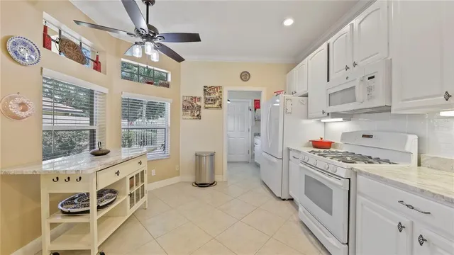 a kitchen with stainless steel appliances a stove a sink and a refrigerator