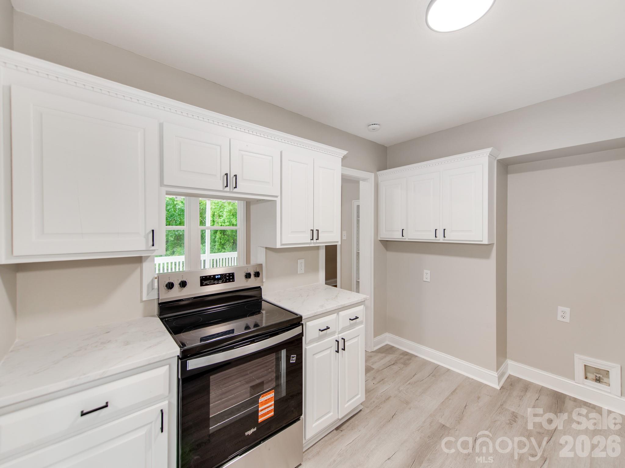 4699 Cherrystone Road Lancaster, SC 29720 - Photo 12 of 28 a kitchen with a stove and a microwave
