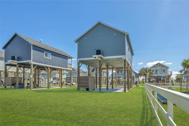 a view of swimming pool with outdoor seating and city view