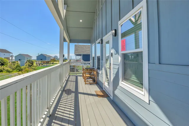 a bathroom with a granite countertop sink mirror and a bathtub