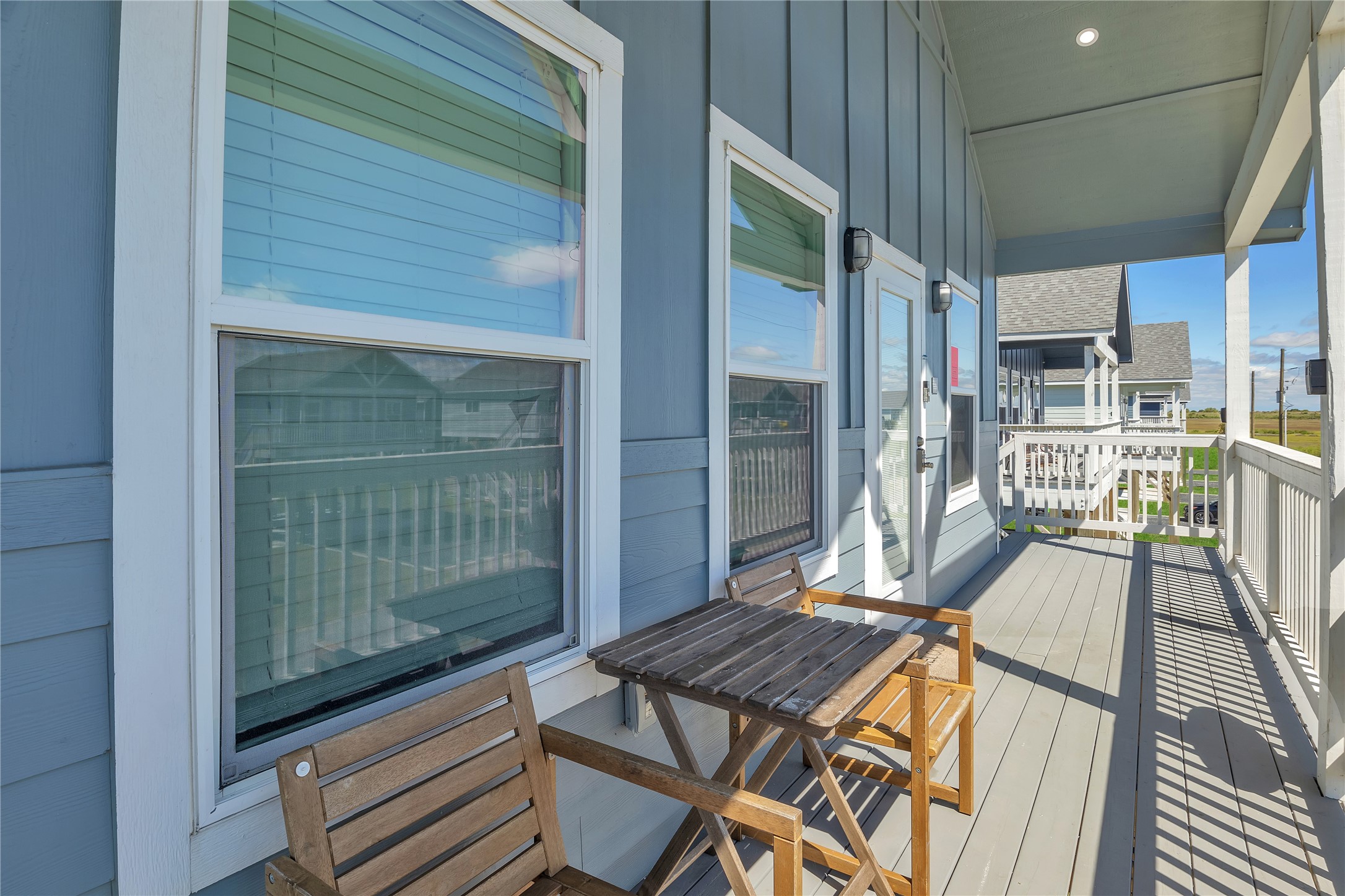 1079 Cedar Lane Port Bolivar, TX 77650 - Photo 20 of 39 a view of a balcony with chair and floor to ceiling window
