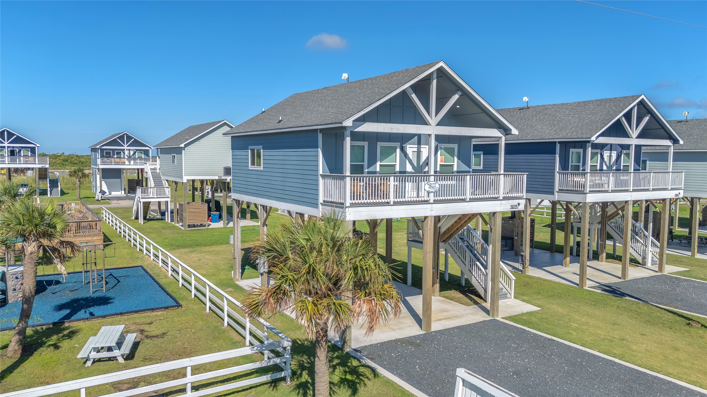 1079 Cedar Lane Port Bolivar, TX 77650 - Photo 2 of 39 a front view of house with yard and glass windows