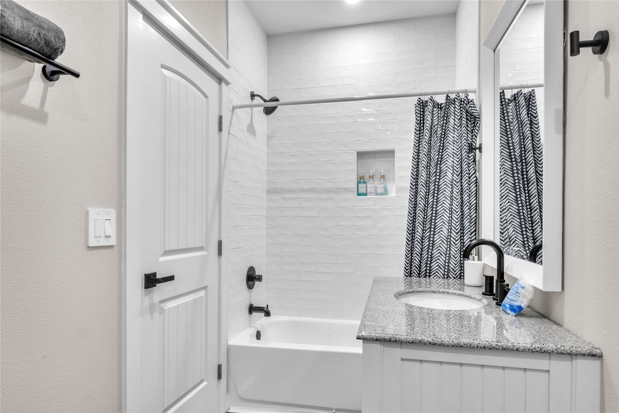 1079 Cedar Lane Port Bolivar, TX 77650 - Photo 21 of 39 a bathroom with a granite countertop sink mirror and a bathtub