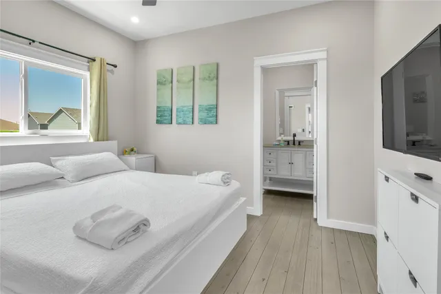 a white toilet sitting next to a bath tub