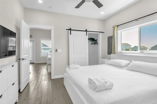 a bathroom with a granite countertop toilet sink and mirror