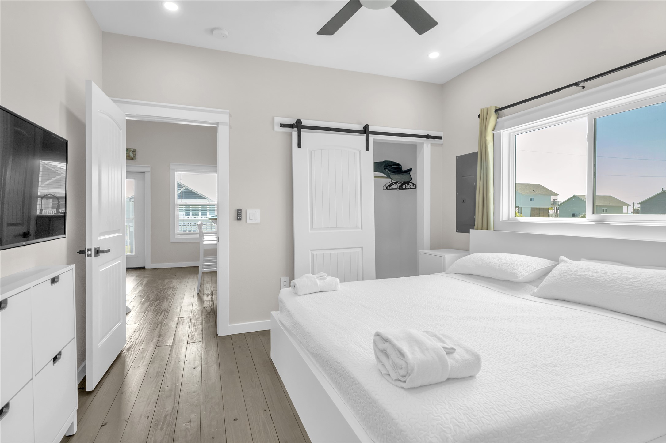 1079 Cedar Lane Port Bolivar, TX 77650 - Photo 26 of 39 a bedroom with a bed and a large window