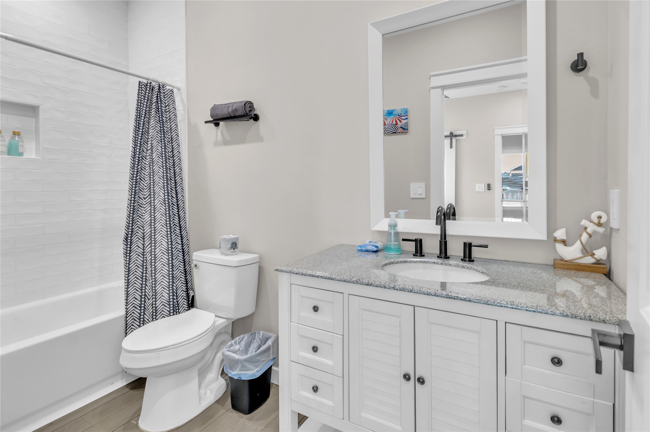 1079 Cedar Lane Port Bolivar, TX 77650 - Photo 28 of 39 a bathroom with a granite countertop toilet sink and mirror