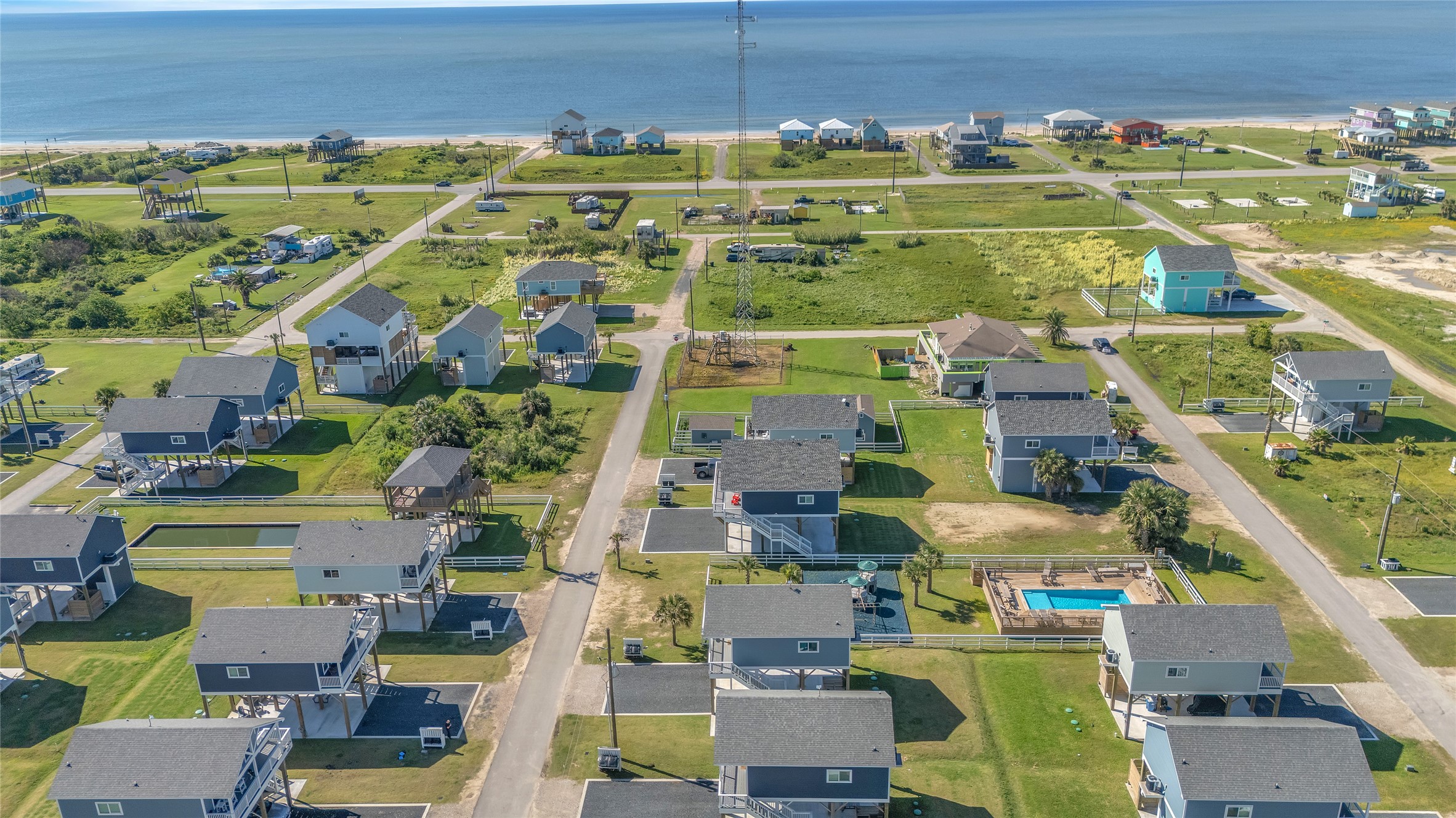 1079 Cedar Lane Port Bolivar, TX 77650 - Photo 6 of 39 an aerial view of residential houses with outdoor space and swimming pool