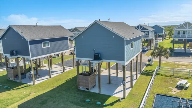 an aerial view of a house with a swimming pool