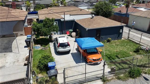 an aerial view of a house roof deck and outdoor seating