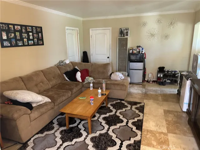a living room with furniture and a rug