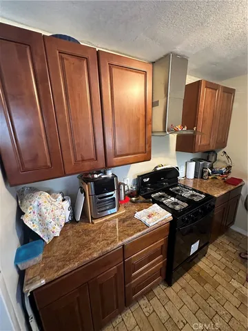 a view of a stove top oven and furniture