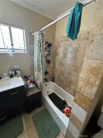 a bathroom with a bathtub sink and toilet
