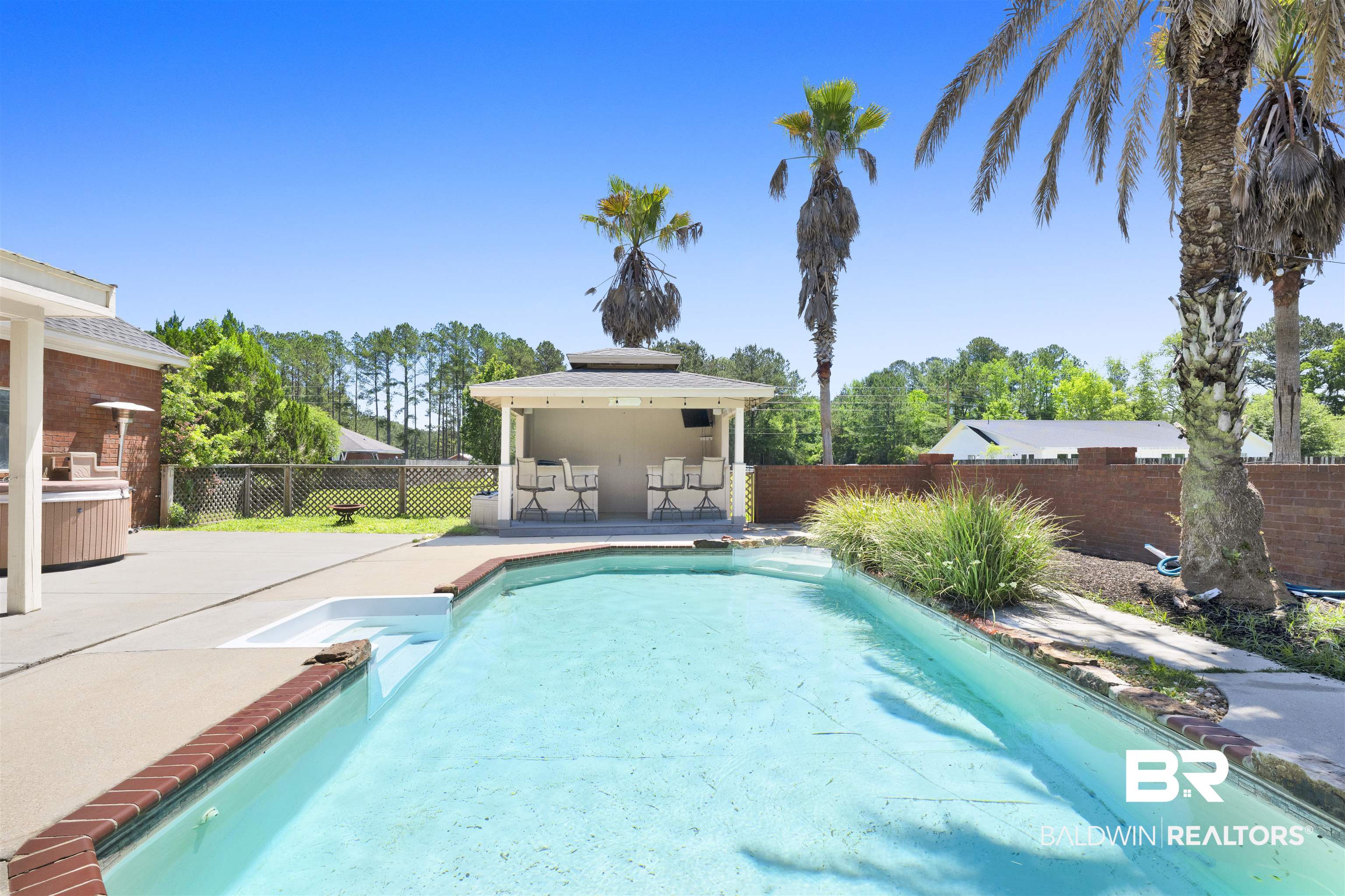 12944 Anna's Way Stapleton, AL 36578 - Photo 23 of 64 In-ground swimming pool featuring a built-in spa
