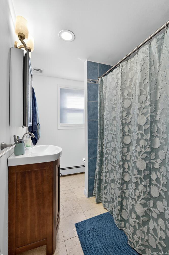 20 Locust Place Locust Valley, NY 11560 - Photo 15 of 16 a bathroom with a sink and a mirror