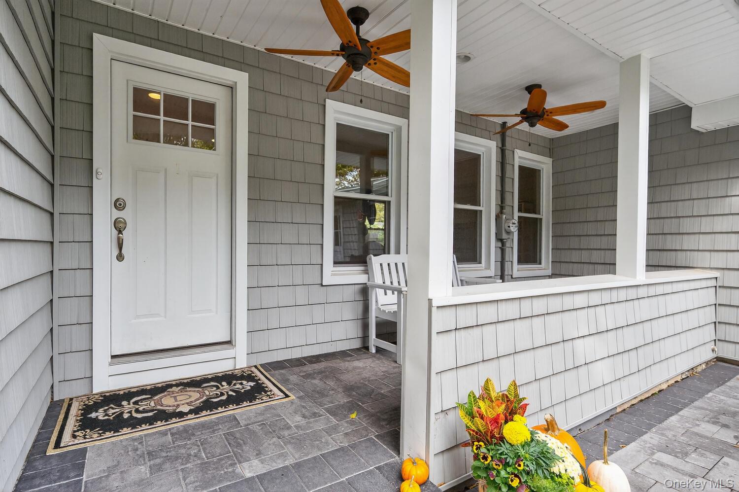 20 Locust Place Locust Valley, NY 11560 - Photo 4 of 16 front view of a house with a garage