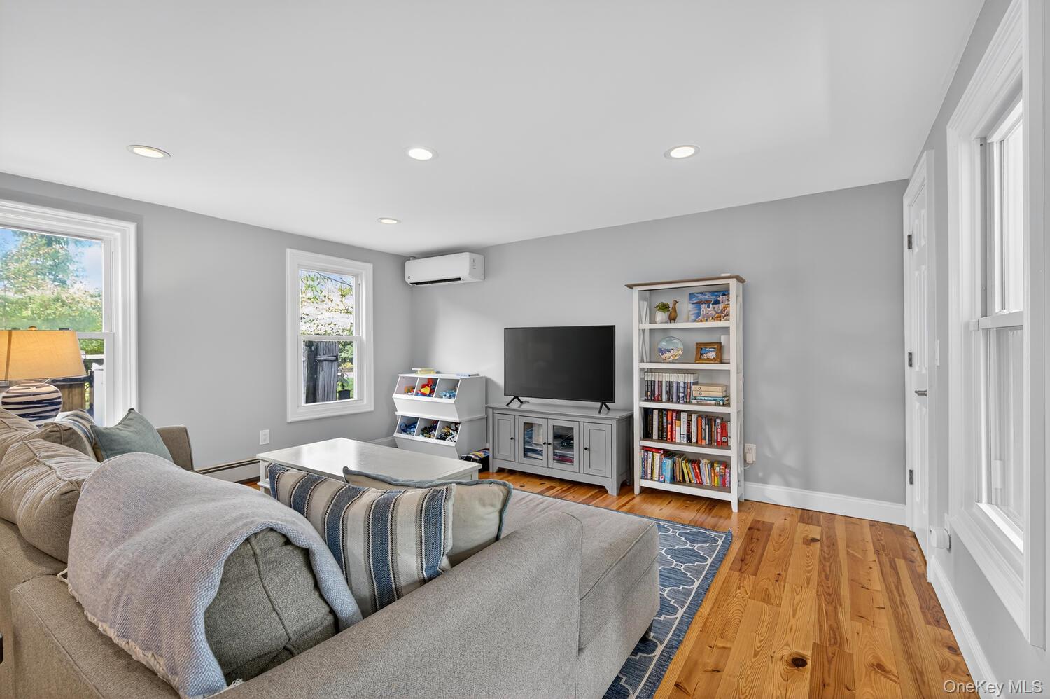 20 Locust Place Locust Valley, NY 11560 - Photo 5 of 16 a living room with furniture and a flat screen tv